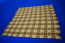 A wonderful Welsh blanket in white, black and mustard colour way, with fringing to two edges, in