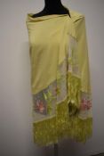 A stunning fringed shawl, around 1920s/30s in a pale green/yellow fabric, feels to be a silk