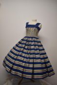 An incredible 1950s Horrockses cotton day dress, having cobalt blue ground with yellow,blue,pink,