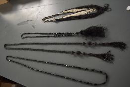 Two antique beaded necklaces, possibly jet and an Art Deco necklace and similar belt.