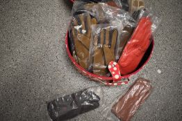 Sixteen pairs of vintage gloves in original packaging.