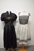 A 1950s German striped cotton sundress, having floral pattern to bodice and hem and a 1940s