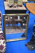 A gilt frame wall mirror