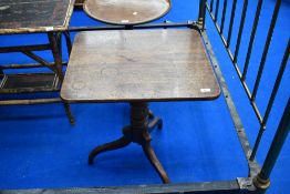 A 19th Century mahogany pedestal occasional table having rectangular top on turned column