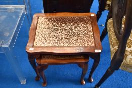 A nest of two copper top tables