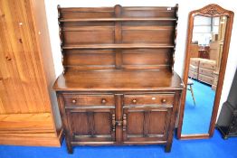 A vintage dark stained Ercol dresser