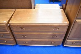 An Ercol bedroom chest of three long drawers