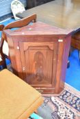 A Victorian style mahogany corner wall cupboard