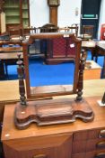 A Victoriann mahogany toilet mirror on trinket base