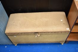 A vintage woven fibre Ottoman