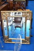 A modern multi panel decorative wall mirror having gilt frame