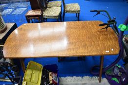 A vintage walnut dining table, labelled David Joel