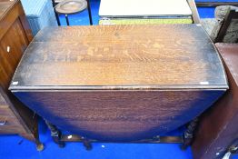 An early 20th century oak gateleg dining table