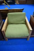 A modern single futon having golden oak frame