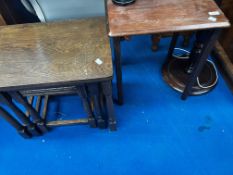 A nest of three traditional tables and a stained frame occasional table