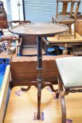 A 19th Century mahogany 'dishtop' occasional wine table having turned pedestal and triple splay