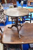 A 19th Century oak low pedestal table having circular top