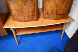 A vintage light teak coffee table with undershelf
