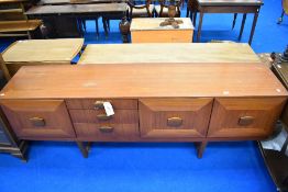 A vintage teak sideboard of stylised design, labelled Stonehill Furniture , width 198cm