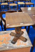 A vintage oak occasional low table having bulbous column
