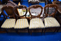 A set of four Victorian mahogany balloon back dining chairs