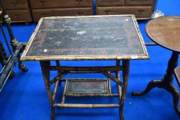 A Victorian bamboo table having lacquered top