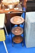 An early 20th Century oak cake stand