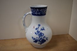 A late 19th century vase, having blue and white floral transfer pattern marked to underside with