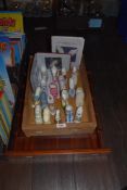 A Historic miniature shoe collection and a display shelf.