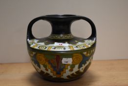 A Hand painted twin handled vase, marked to underside Arnhem, Holland, EU 43.