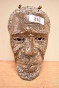 An African stoneware mask.