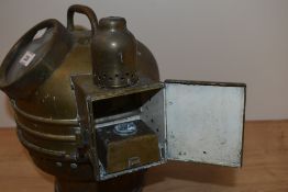 An early 20th century brass Binnacle housing compass, with casing for oil lighting to side.