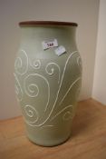 A Denby vase, having green ground with white swirled glaze.