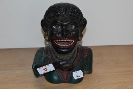 A vintage cast metal 'Dinah' mechanical money box.