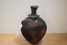 A spherical studio bottle with stopper, having textured finish, with Belgium label for Marc