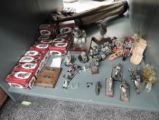 A shelf of modern Motorbike Models including Atlas x 15 in boxes along with modern model Engines