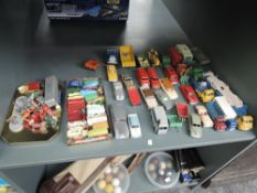 A shelf of playworn diecasts including Dinky, Corgi, Spot-On, Matchbox Lesney etc, many repaints and