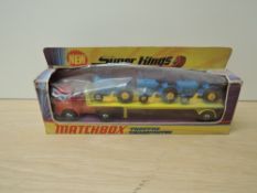 A 1971 Matchbox Super Kings diecasts, K20 Tractor Transporter in yellow and red with three
