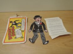 An original Dancing Charlie Illusion Doll, in original paper envelope with instructions present