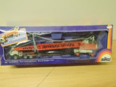 A 1980's Siku diecast, 4011 Tower Construction Crane in red, grey and black, boxed, models appear