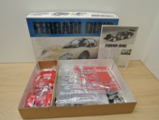 A Bandai 8042 1:16 scale Plastic Kit, Ferrari Dino in red, not checked for completeness, appears