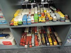 Two shelves of early Siku playworn diecasts, Articulated Wagons, Tankers, Construction Trucks etc,