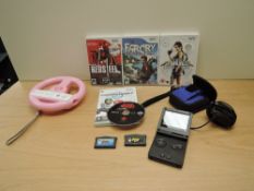 A Nintendo Game Boy Advance with two games Spyro Season Ice and Crash Bandicot XS, power lead, XEH