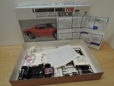 Two Otaki 1:16 plastic kits, Bertone's Jaguar Pirana and Lamborghini Miura P400, not checked for