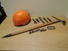 A collection of vintage Climbing Equipment, Stubai wooden shafted Ice Axe, seven Stubai Pittons