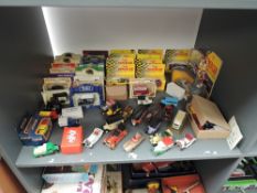 A shelf of diecasts including Matchbox MB 38 Ford Model A Vans x2, boxed, Corgi C811/1 1`954