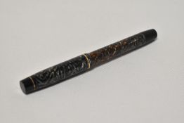 An Onoto the Pen 5601 by De La Rue piston fill fountain pen with translucent barrel with wave