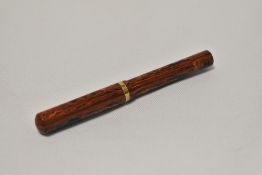 An Onoto the Pen 5000 by De La Rue piston fill fountain pen in black and red HR with a gold band to