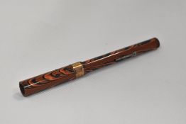 A Golden Guinea 21/- lever fill fountain pen in red and black HR ripple with broad band to the cap