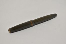 A Parker Duofold button fill fountain pen in sage green with broad decorative band to the cap having